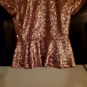 Selling this beautiful sequin top that I cannot fit. Have not been worn.